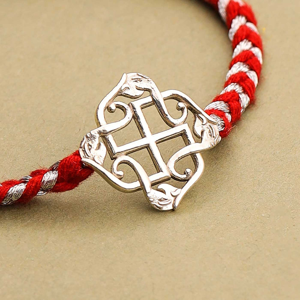 Handmade Swastik Design Silver Rakhi For Brother - Close-up of Metal Pendant Detail