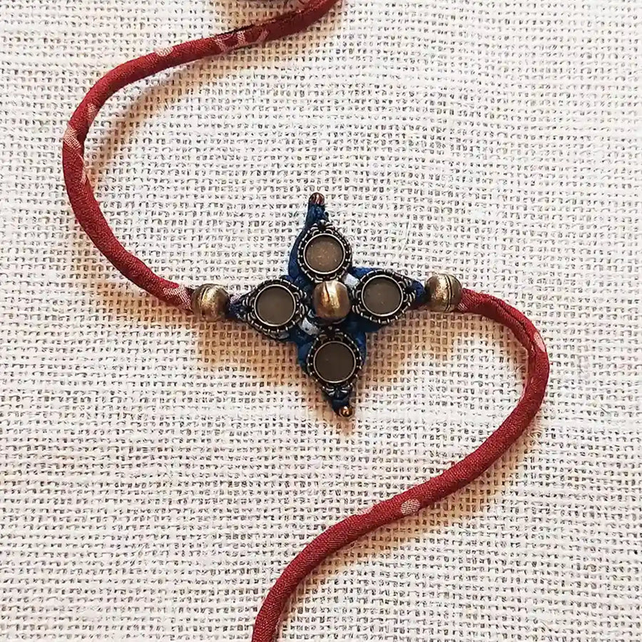 Handmade Dori Work Vintage Ajrakh Rakhi With Roli Chawal - Close-up of Pendant Charm