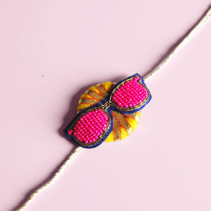 Handmade Reusable Chashma Pom Pom Felt Kids Rakhi - Close-up with Pink Background (8)