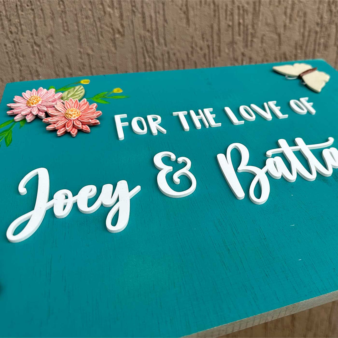 Personalized Handmade Floral Wooden Name Plate For Couples - Angled Close-up of Text Personalization