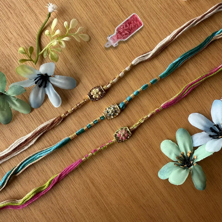 Handmade Stone Embedded Flower Rakhi With Roli Chawal - Laid Flat with Floral Accent