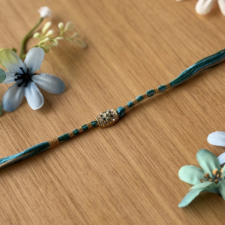 Handmade Stone Embedded Flower Rakhi With Roli Chawal - Single Bracelet Close-up Blue Variant