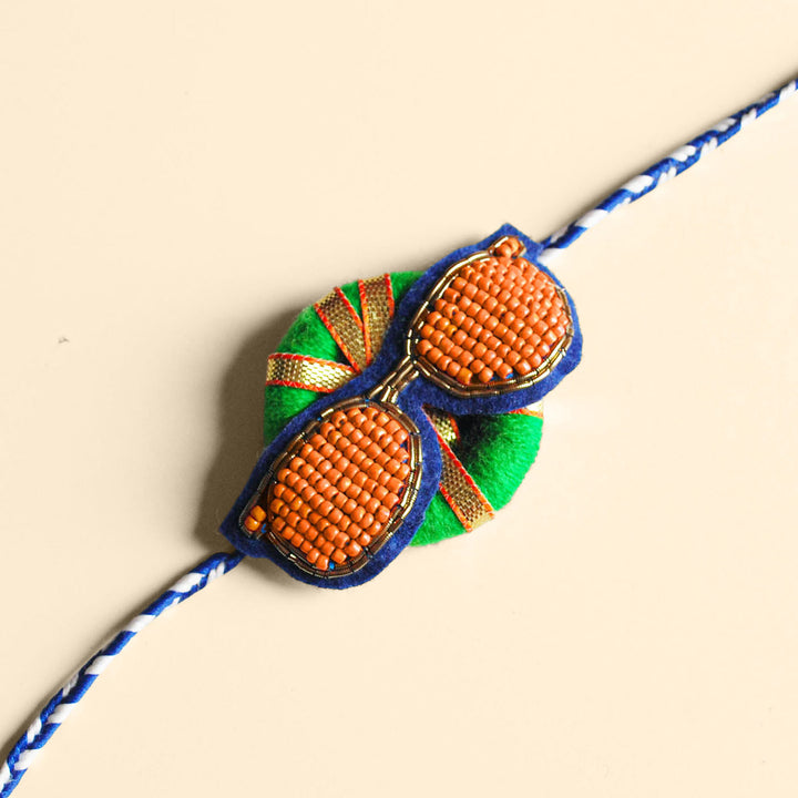 Handmade Reusable Chashma Pom Pom Felt Kids Rakhi - Close-up with Plain Background