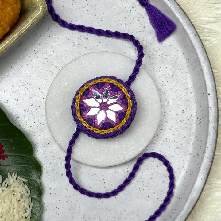 Customized Handmade Mirror Work Cotton Rakhi With Roli Chawal - Styled Front View on Plate (4)