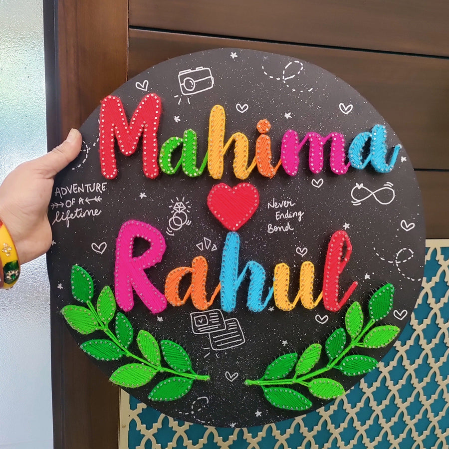 Personalized String Art A Leafy Embrace Mdf Wood Name Plate For Couples - Front View Held in Hand