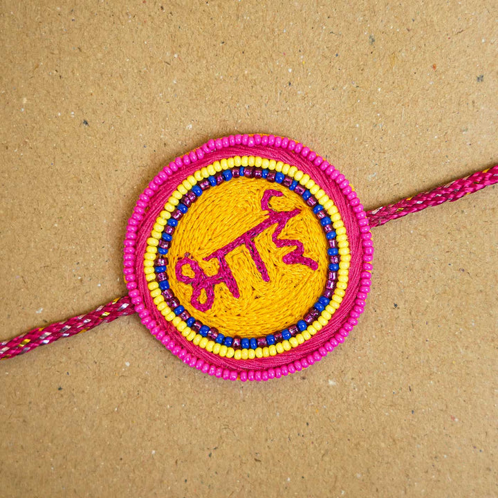 Handmade Beaded Bhai Rakhi With Roli Chawal - Close-up of Rakhi face