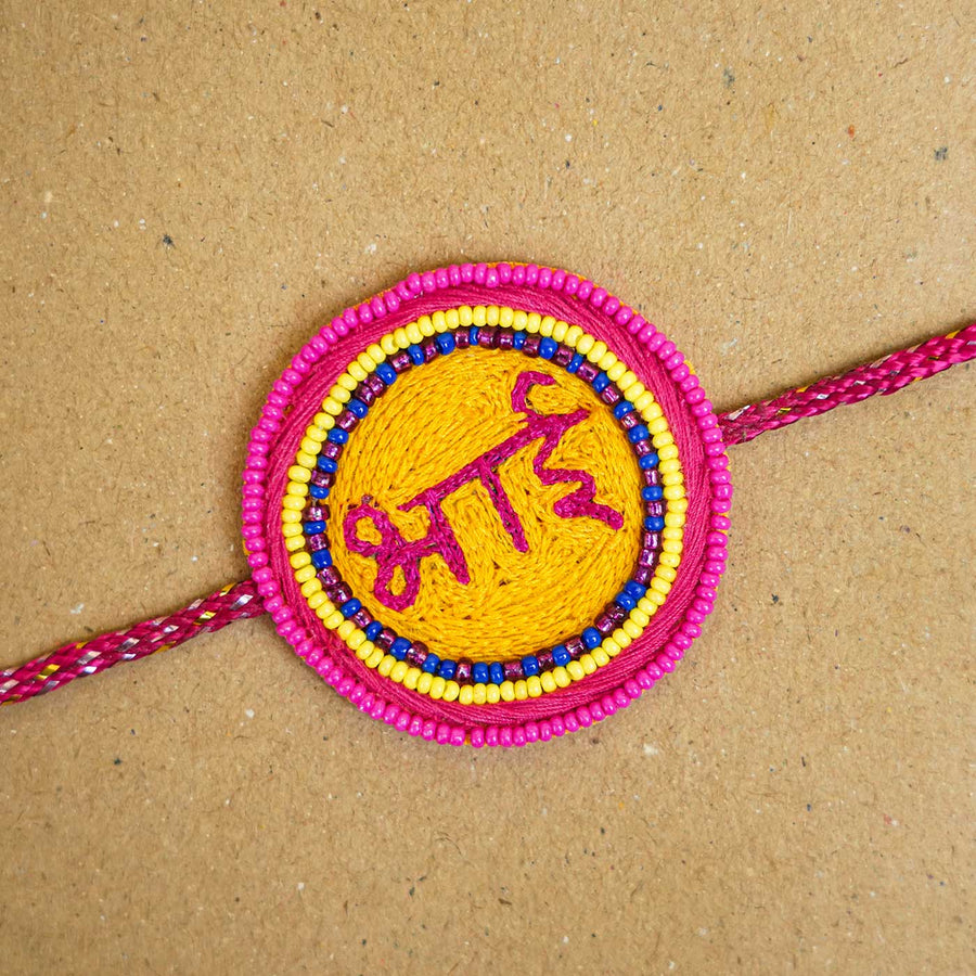 Handmade Beaded Bhai Rakhi With Roli Chawal - Close-up of Rakhi face