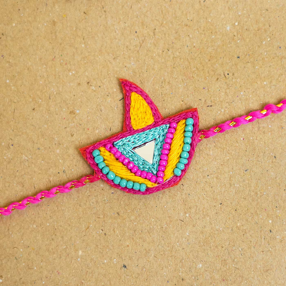 Handmade Beaded Mango Bite Rakhi Hamper For Sisters Set Of 4 - Close-up of Embroidered Rakhi