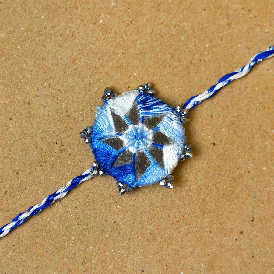Handmade Mirror Work Kaanha Ombre Blue Cotton Rakhi With Roli Chawal - Close-up of single rakhi