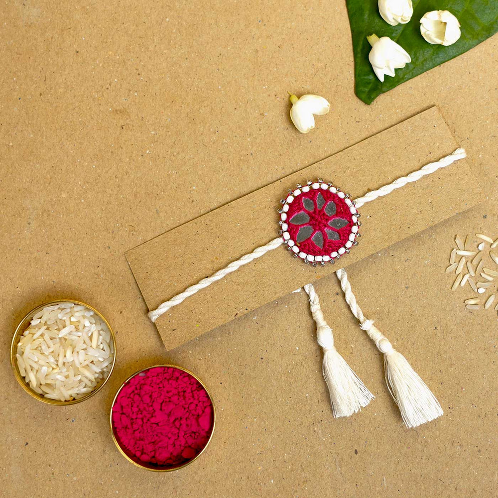 Handmade Mirror Work Kajal Maroon White Cotton Rakhi With Roli Chawal - Rakhi with packaging and accessories