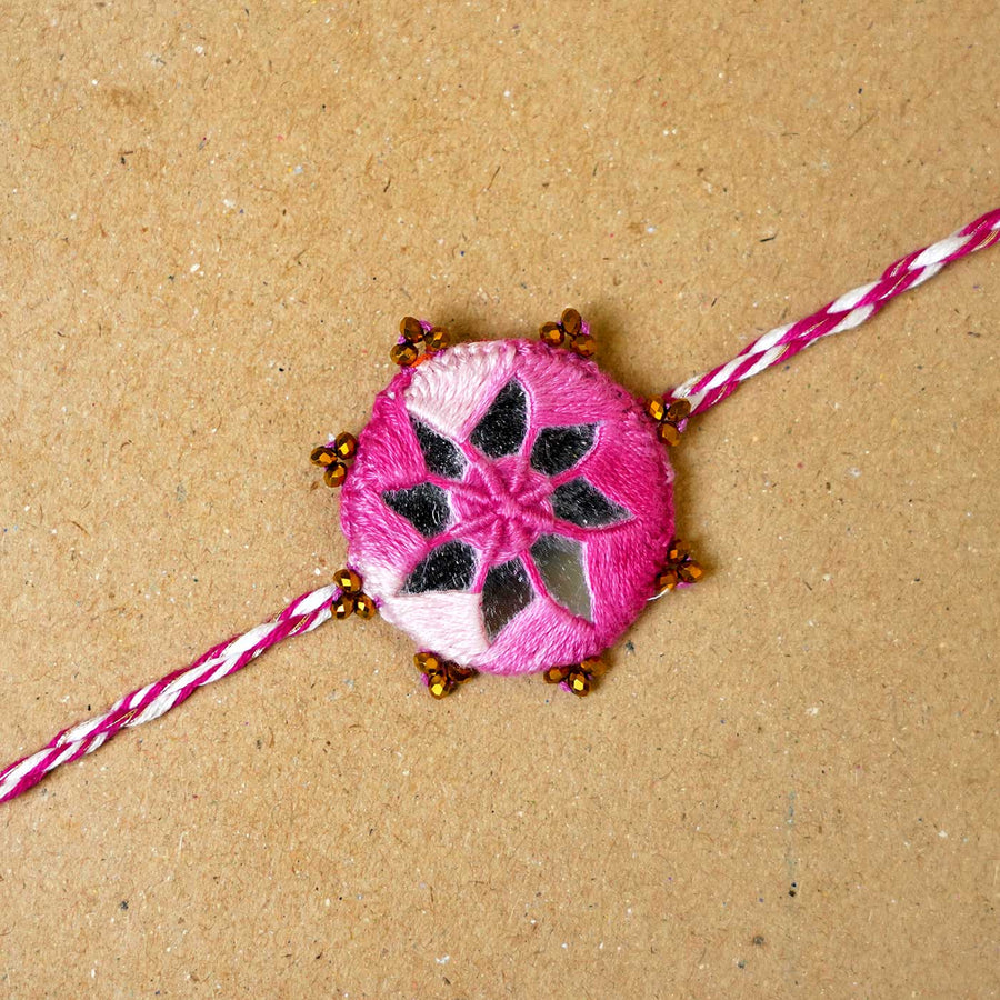 Handmade Mirror Work Kaanha Ombre Pink Cotton Rakhi With Roli Chawal - Close-up of single Rakhi