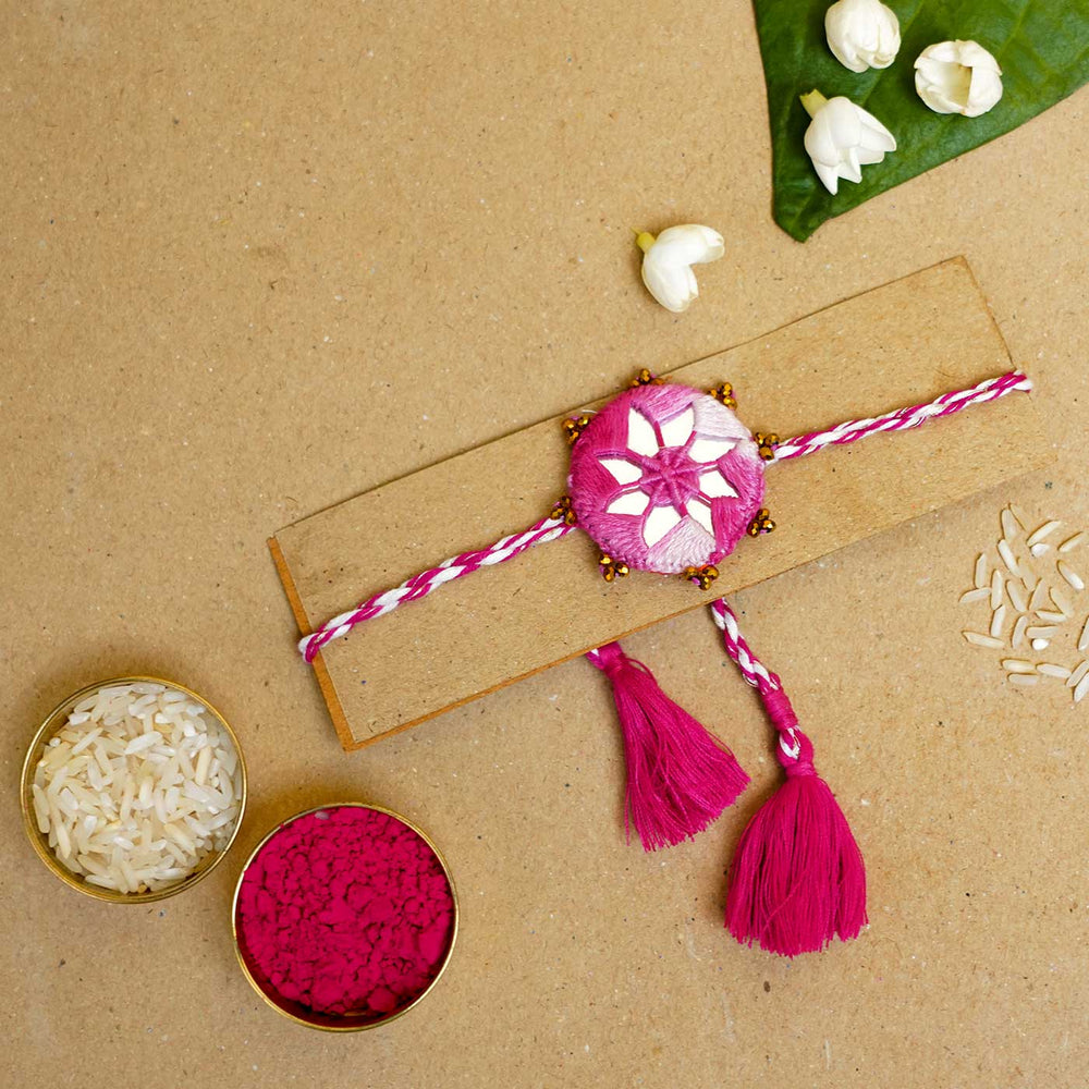 Handmade Mirror Work Kaanha Ombre Pink Cotton Rakhi With Roli Chawal - Rakhi with traditional items display