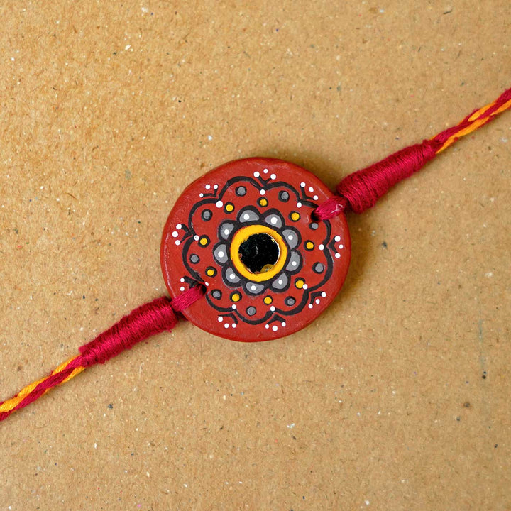 Hand Painted Taaramandal Terracotta Rakhi With Roli Chawal - Close-up of Rakhi Bead Design