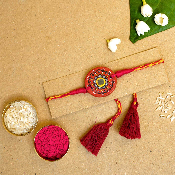 Hand Painted Taaramandal Terracotta Rakhi With Roli Chawal - Styled Rakhi with Accessories
