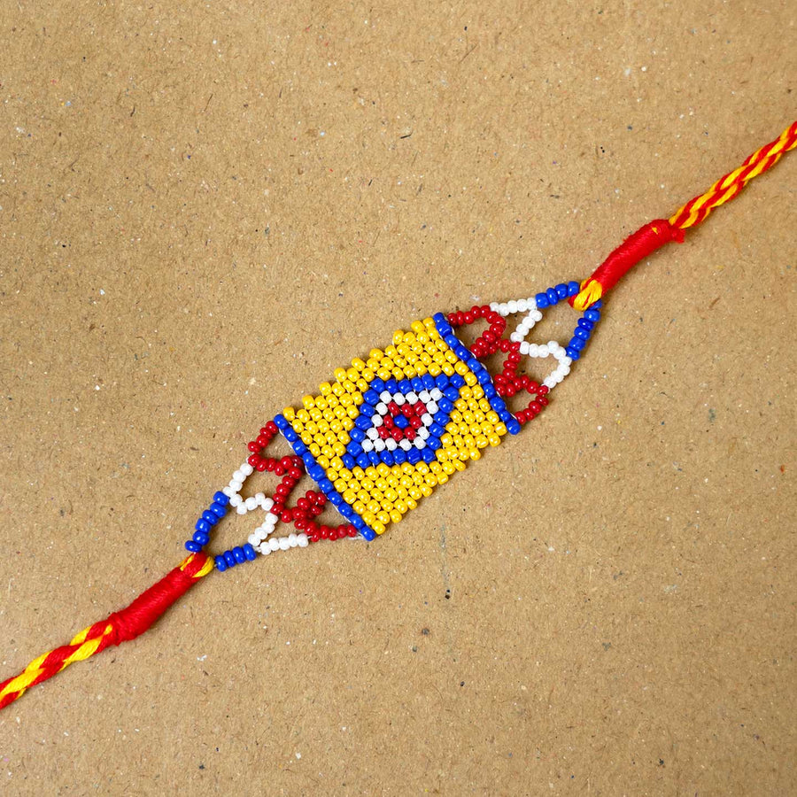 Handmade Beaded Heritage Rakhi With Roli Chawal - Close-up of single Rakhi