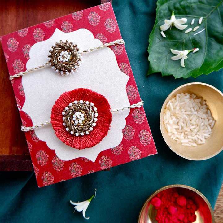 Handmade Zardozi Mustard And White Bead Work Rakhi With Wooden Box And Roli Chawal Set Of 2 - Paired Display on Decorative Card