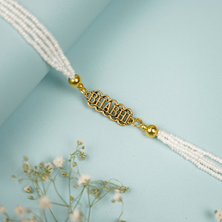 Photo Personalized Handmade Pyaari Bhabhi Theme Terracotta Mug - Close-up of Rakhi Bracelet Charm