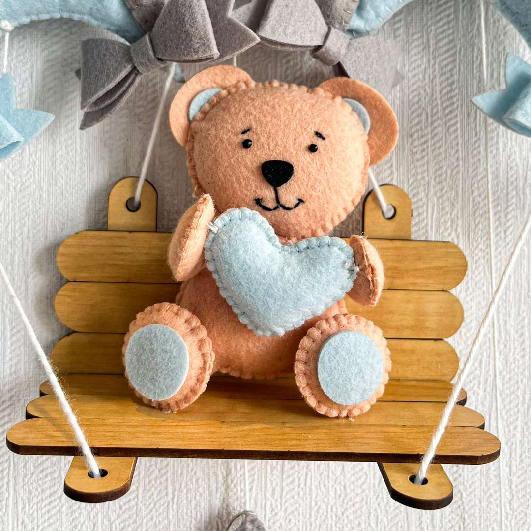 Personalized Blue Teddy On A Swing Theme Felt Kids Name Plate - Front View of Hanging Plush Display