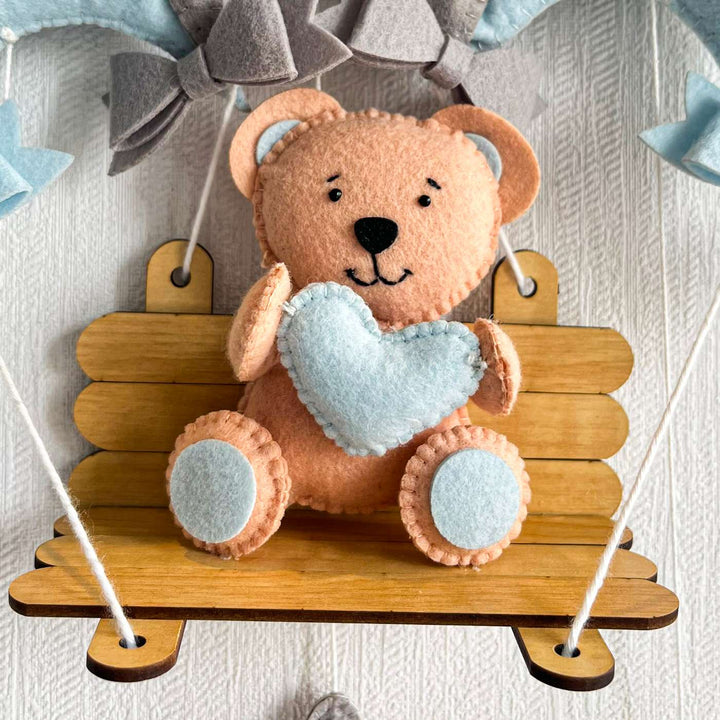 Personalized Blue Teddy On A Swing Theme Felt Kids Name Plate - Front View of Hanging Plush Display