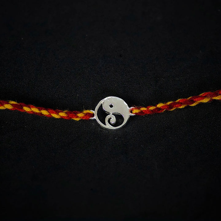 Handmade Bappa 925 Silver Rakhi With Roli Chawal For Brother - Close-up of Pendant Centerpiece