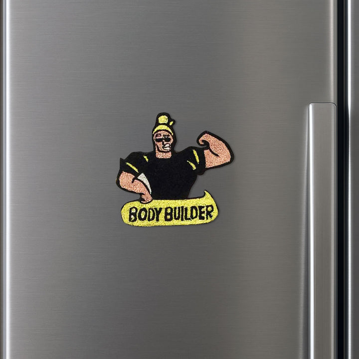 Handmade Reusable Body Builder Pom Pom Felt Kids Rakhi - Mounted on Metallic Surface