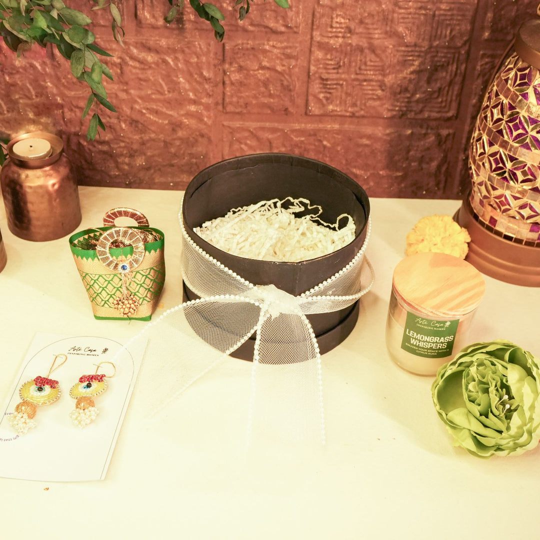 Aura Diwali Gift Hamper | Includes 2 Hangings, 1 Candle, 1 Dry Fruit Potli, 1 Decor Flower, 1 Diwali Card, 1 Round Gift Box