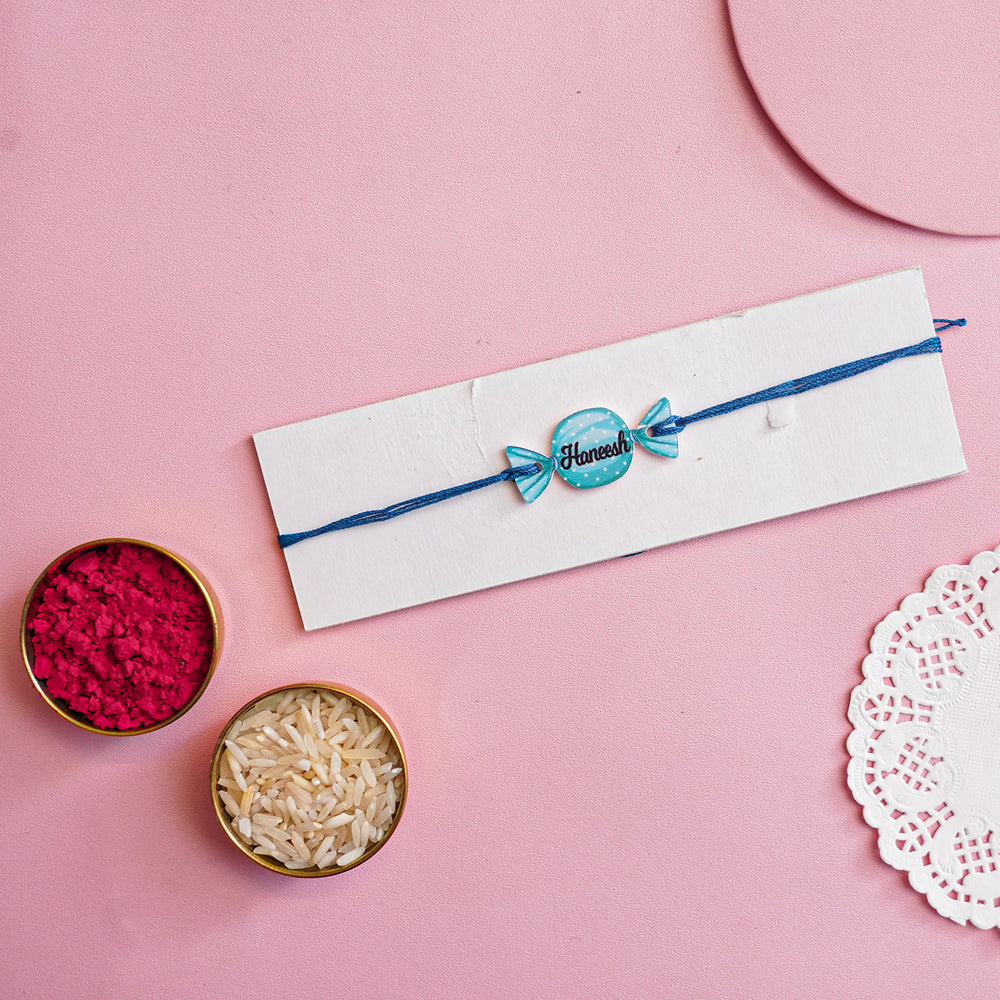 Personalized Handmade Candy Acrylic Kids Rakhi With Roli Chawal - Bracelet on display card with decor