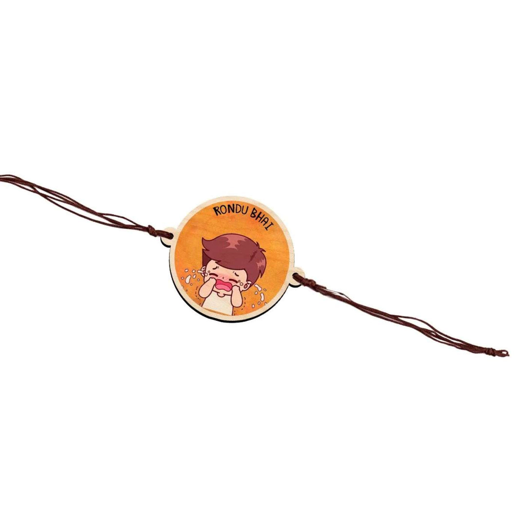 Handmade Rondu Bhai Wooden Rakhi With Roli Chawal - Rakhi product flat lay on white