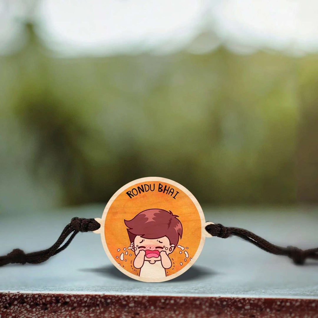 Handmade Rondu Bhai Wooden Rakhi With Roli Chawal - Close-up of Rakhi with design