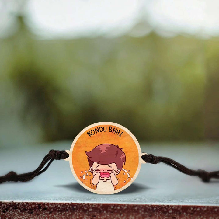 Handmade Rondu Bhai Wooden Rakhi With Roli Chawal - Close-up of Rakhi with design