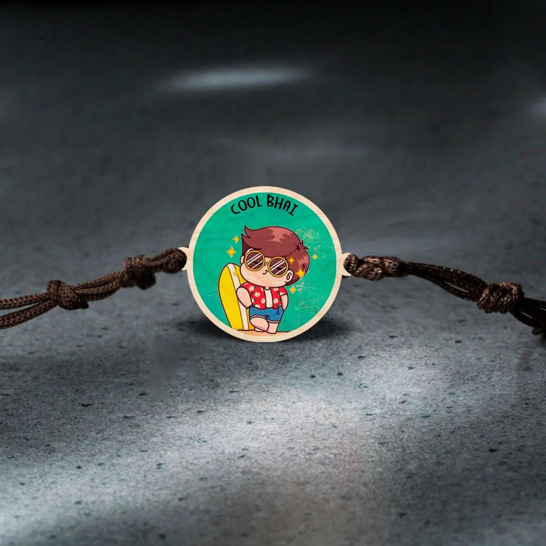 Handmade Cool Bhai Wooden Rakhi With Roli Chawal - Top view on textured surface