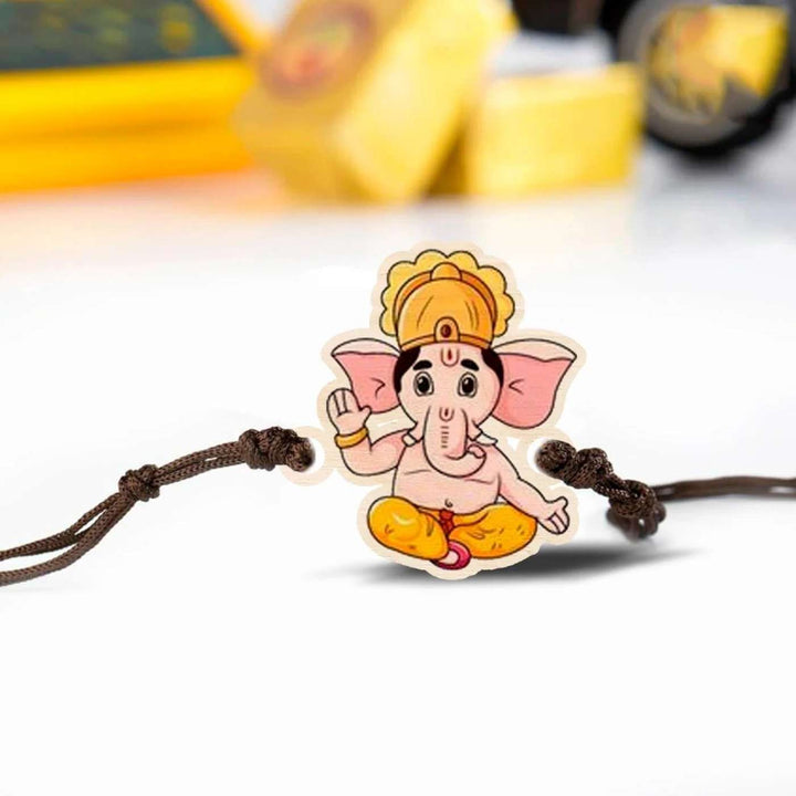 Handmade Ganesha Wooden Rakhi With Roli Chawal - Close-up Front View