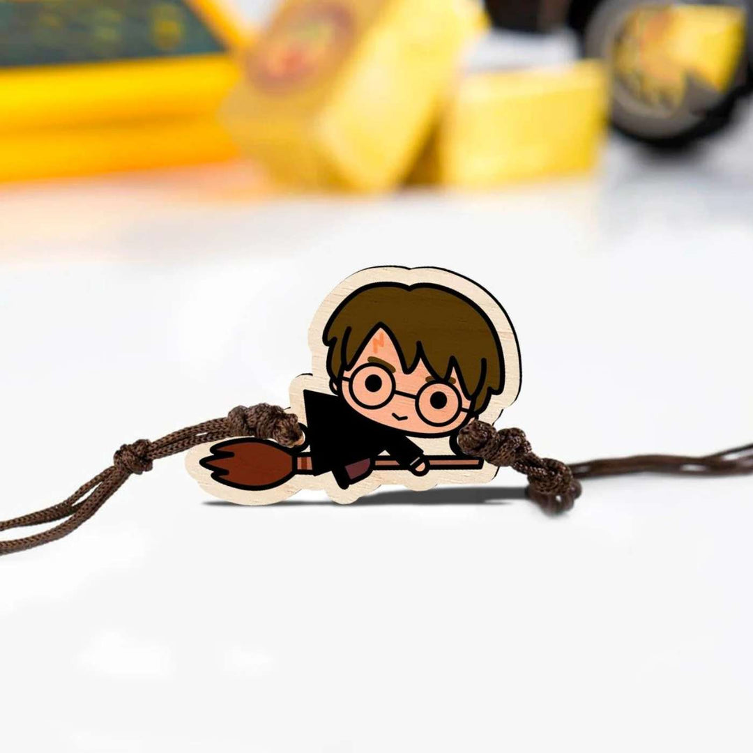 Handmade Harry Potter Broom Wooden Kids Rakhi With Roli Chawal - Close-up of Rakhi charm