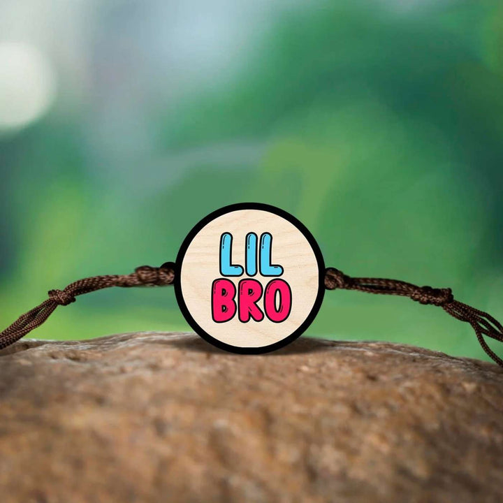 Handmade Little Bro Wooden Rakhi With Roli Chawal - Close-up of bracelet centerpiece