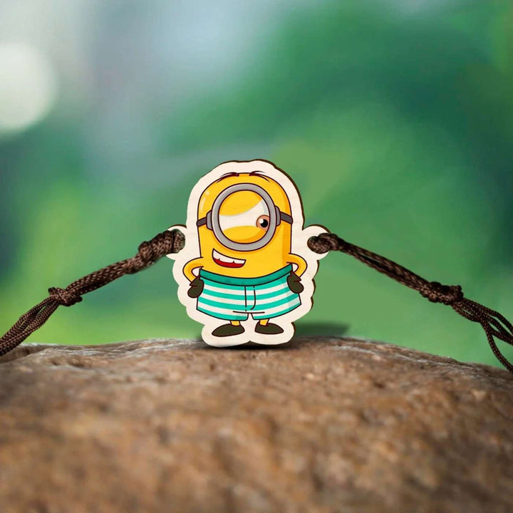 Handmade Minion Wooden Kids Rakhi With Roli Chawal - Outdoor Close-up