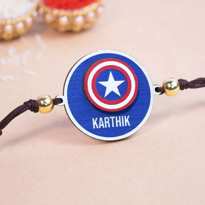Personalized Handmade Captian America Wooden Kids Rakhi With Roli Chawal - Close-up of Personalized Rakhi