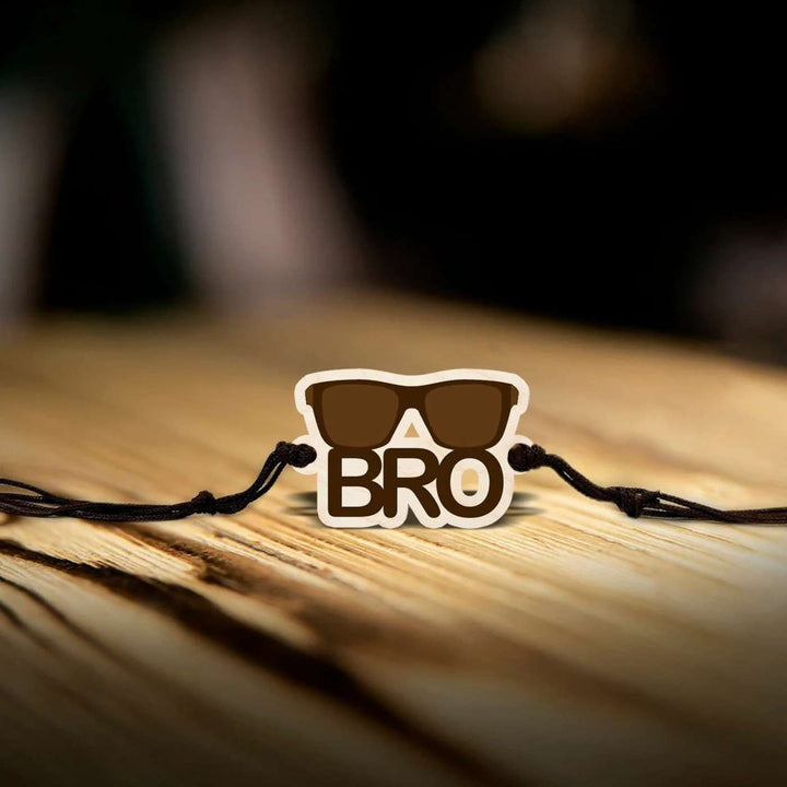 Handmade Sunglasses Bro Wooden Rakhi With Roli Chawal - Bracelet on wooden surface
