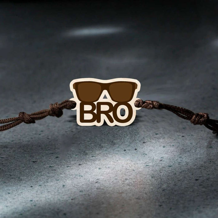 Handmade Sunglasses Bro Wooden Rakhi With Roli Chawal - Bracelet on dark textured floor