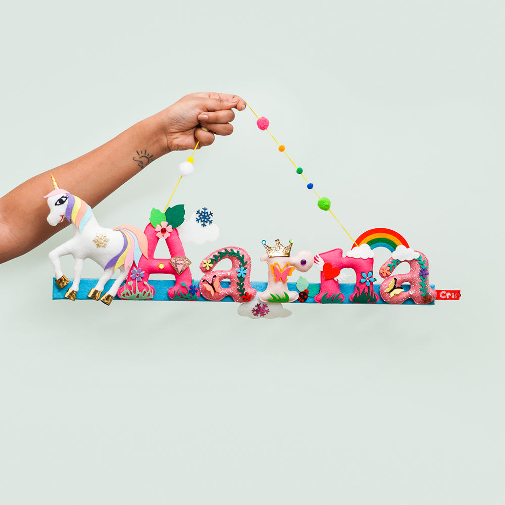 Unicorn Name Plate For Kids - Held by Hand Showing Hanging String