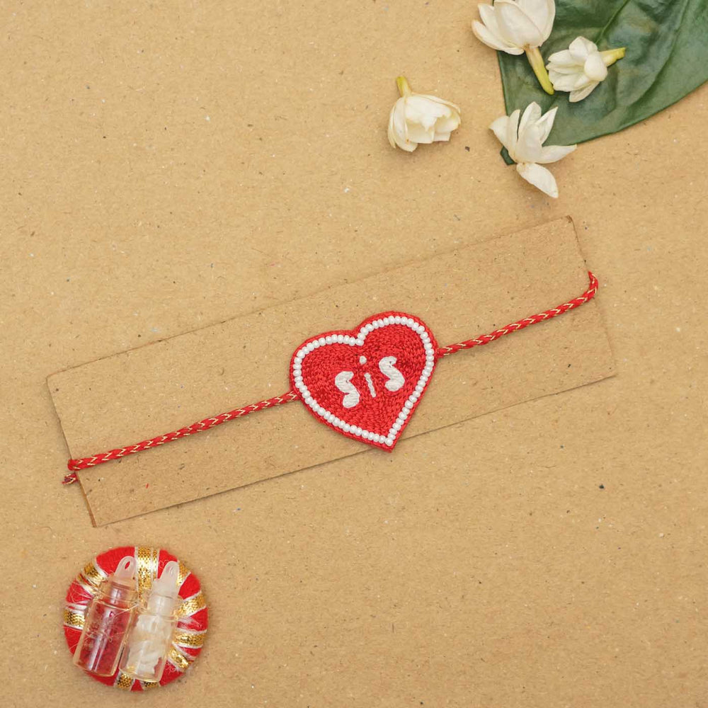Handmade Beaded Sis Red Rakhi With Roli Chawal - Laid Flat with Packaging