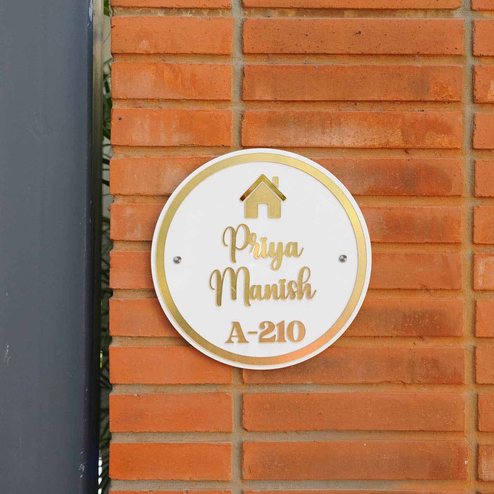 Personalized Round Orange And White Acrylic Name Plate - Mounted on Brick Wall Front View