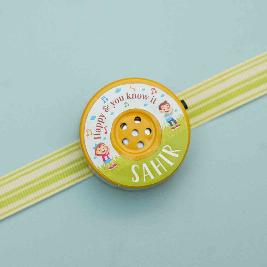 Personalized Musical If Youre Happy And You Know It Kids Rakhi With Roli Chawal - Close-up of Name Personalization Example
