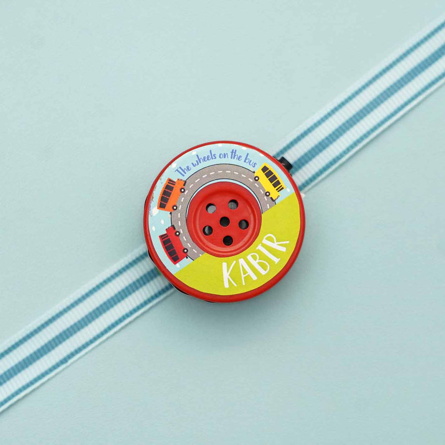 Personalized Musical Wheels On The Bus Kids Rakhi With Roli Chawal - Close-up Front View
