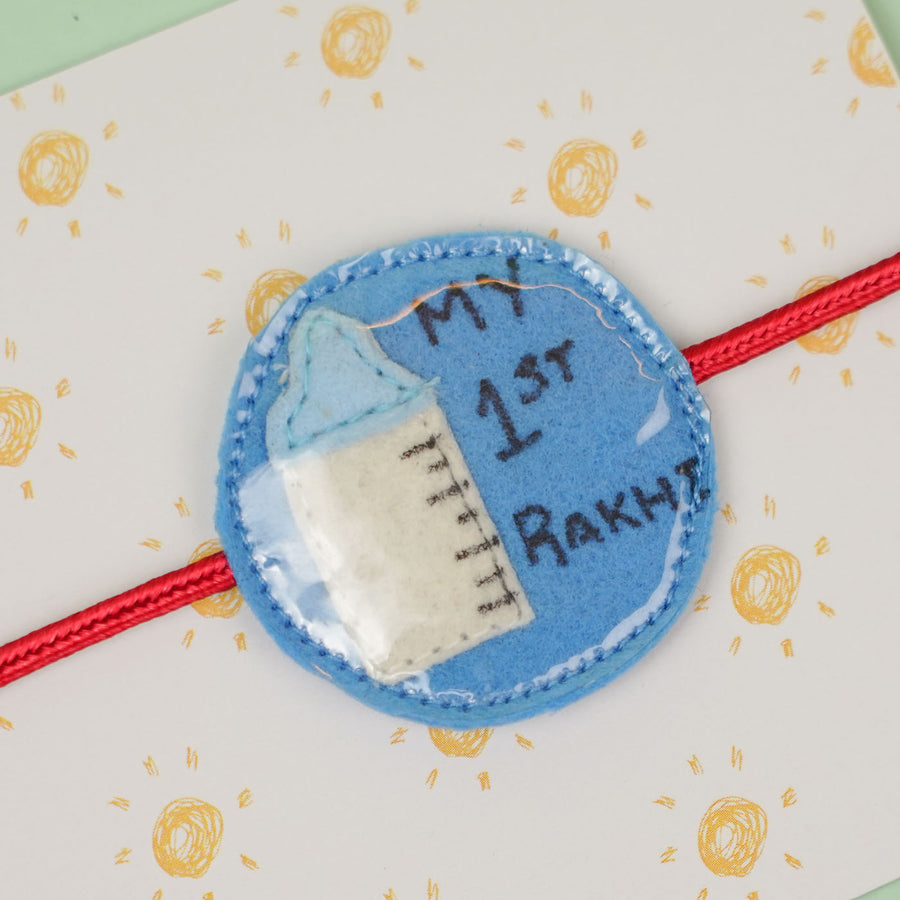 Handmade Feeding Bottle Theme Blue Felt Kids Rakhi For Brother - Close-up Front View