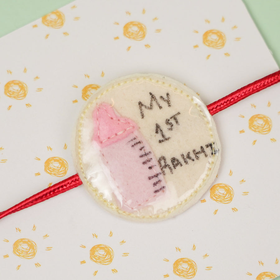 Handmade Feeding Bottle Theme Girl Felt Kids Rakhi For Sisters - Close-up of Rakhi Badge