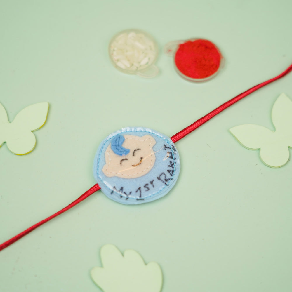 Handmade Baby Boy Theme Felt Kids Rakhi For Brother - Flat Lay with Color Powders