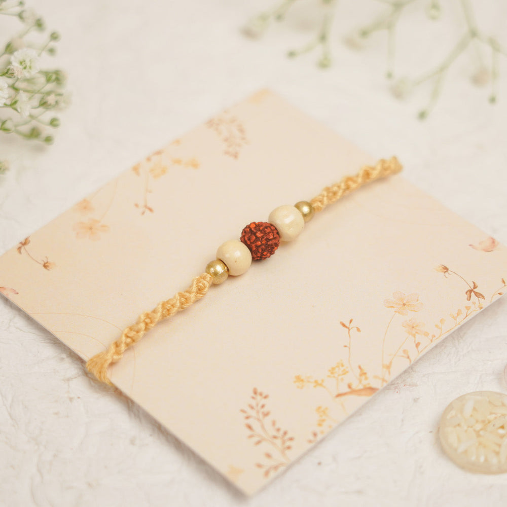 Handmade Pearl Rudraksha Rakhi With Roli Chawal - Close-up on Bracelet Design