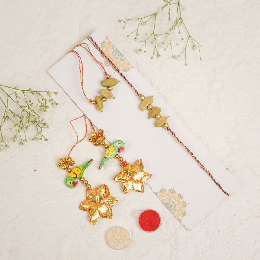 Handmade Sugandh Sutra Parrot Charm And Ghungroo Bhaiya Bhabhi Rakhi With Roli Chawal - Full Set Laid Out