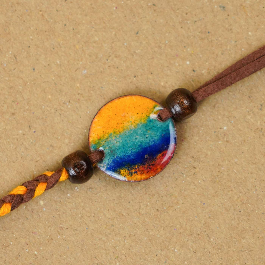 Handmade Indraa Multicolour Copper Enamel Rakhi With Chocolates And Roli Chawal - Close-up of Bracelet Charm