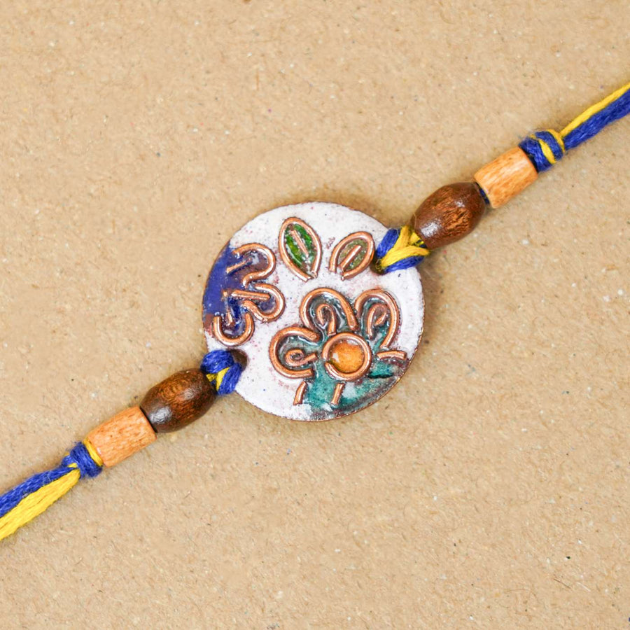 Handmade Phool White Copper Enamel Rakhi With Chocolates And Roli Chawal - Close-up of Rakhi thread detail